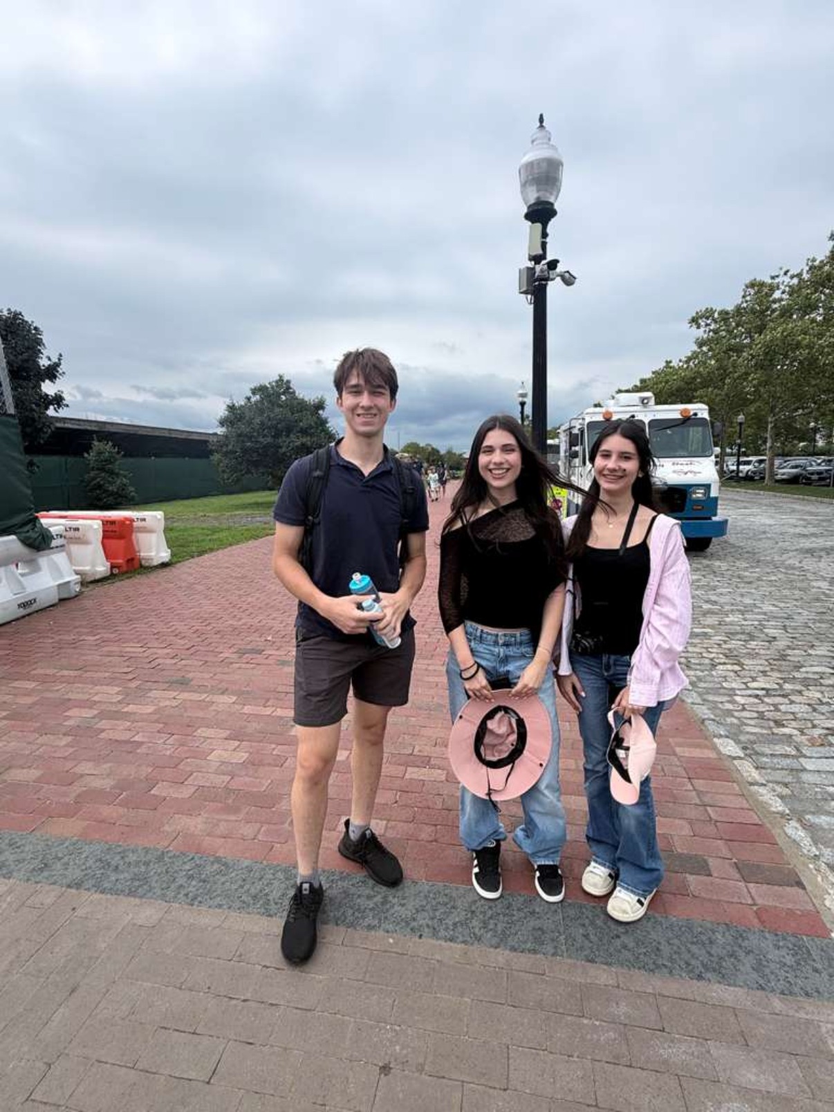 Pedals & Pages founder with two students on the U.S. Education Trip.