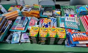 Books and school supplies organized for distribution.